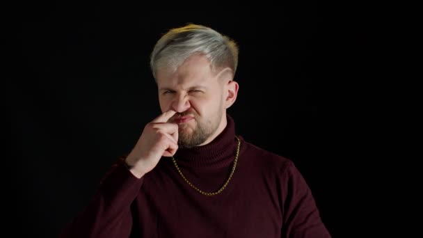 Funny stupid stylish man picking nose and ear, removing boogers, uncultured habit, bad manners - Footage, Video