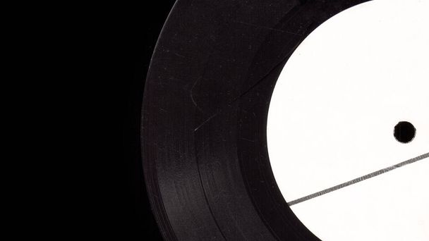 Scratching vinyl record music closeup background. Broken vinyl isolate. Nostalgia music pattern. Old vinyl plate. Melancholy vintage stylized photo. - Photo, Image