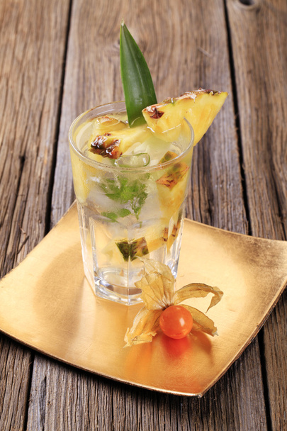 Glass of iced drink with fresh pineapple - Photo, Image