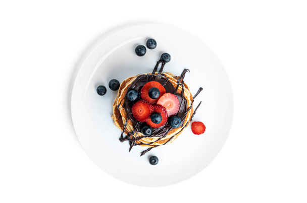 Pancakes with berries and chocolate isolated on a white background. - Foto, Imagem