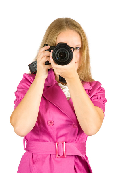 Mädchen trägt rosa Kamera und macht Foto - Foto, Bild
