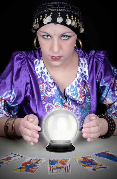 Gypsy fortuneteller uses a crystal ball  - Фото, зображення