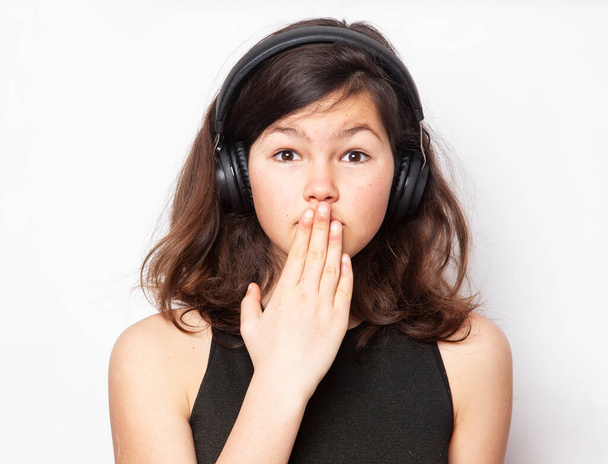 Teenager listening music with headphones isolated on pure white - Фото, зображення