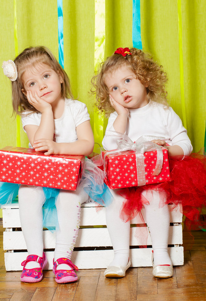 Little girls in fluffy skirts with gift boxes - Zdjęcie, obraz