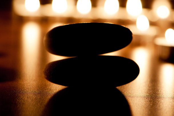 Burning candles and pebbles for aromatherapy session - Foto, Imagem