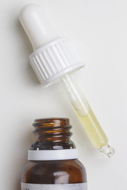 Nourishing and hydrating facial serum in glass dropper, close up image - Photo, Image