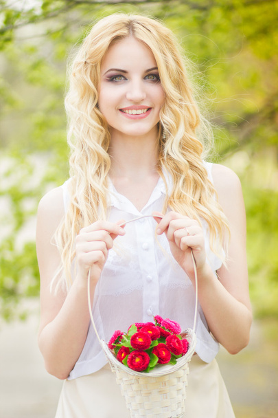Portrait of a beautiful young blonde woman on a sunny summer day - Fotoğraf, Görsel