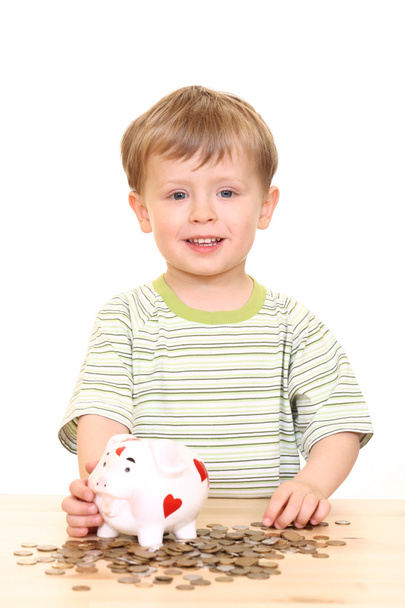 three years old boy and piggy bank isolated on white - Photo, Image