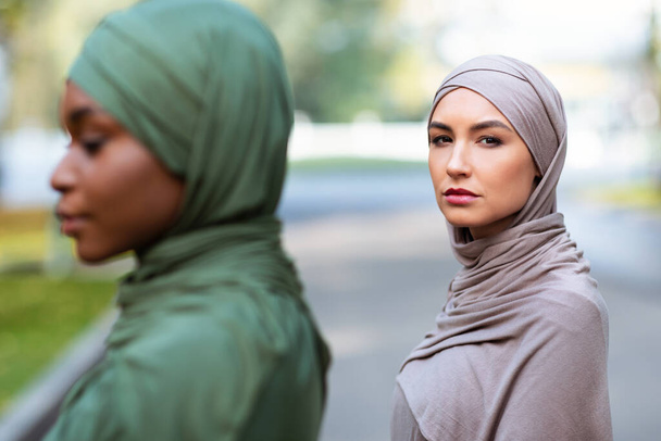Two Diverse Muslim Women Posing Outdoors, Wearing Traditional Hijab - Photo, Image