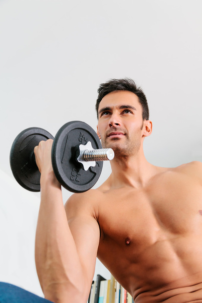 Young Man Doing Weights - 写真・画像