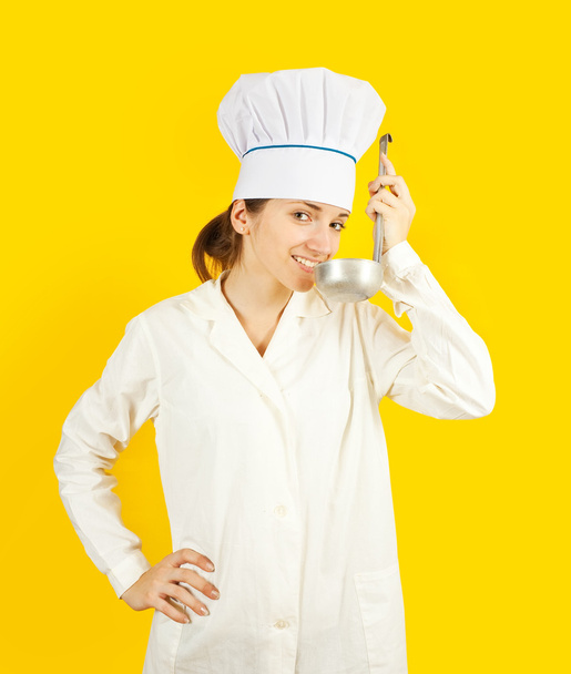 Female chef tasting from ladle - Foto, Bild