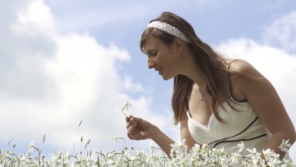 Girl smelling white flower - Footage, Video