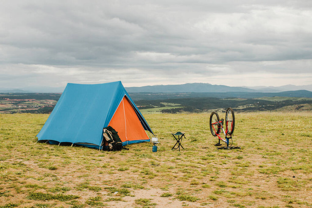 tent bike countryside. Resolution and high quality beautiful photo - Photo, Image