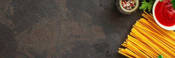 ingredients for pasta on dark stone background - Фото, изображение