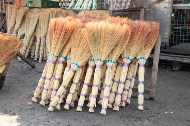 many new brooms in the bazaar are on sale in Ukraine in the city of Dnipro - Valokuva, kuva