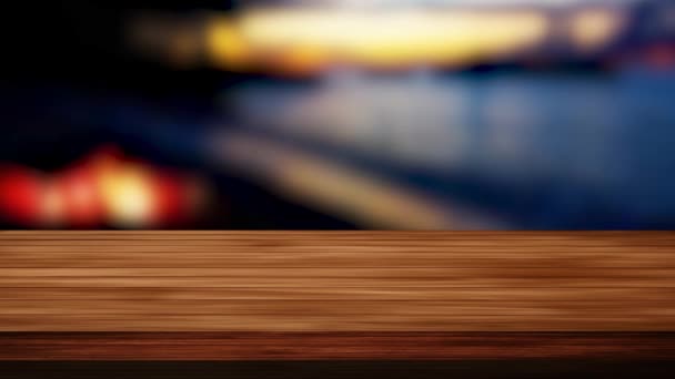 Drewniany stół bar i rozmyty widok na noc w tle. Efekt świetlny i wyciek. Nagrania HD - Materiał filmowy, wideo