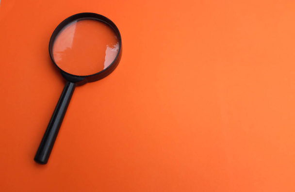 copy space magnifying glass isolate on orange background - Photo, Image