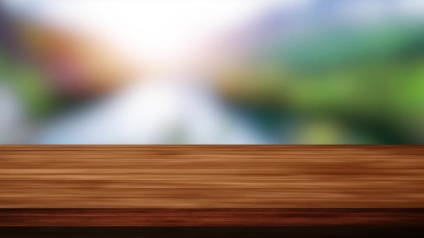 ぼやけた多色の背景の前に空の木製の板テーブル。光とリーク効果。HD  - 映像、動画
