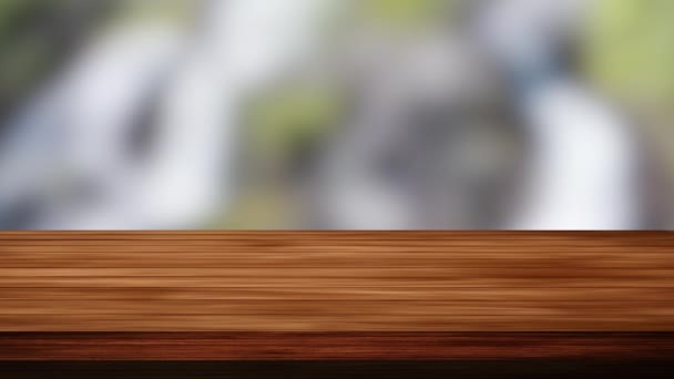 Prázdný dřevěný stůl před černošedým a zeleným pozadím. Lehký a netěsný efekt. HD záznam - Záběry, video