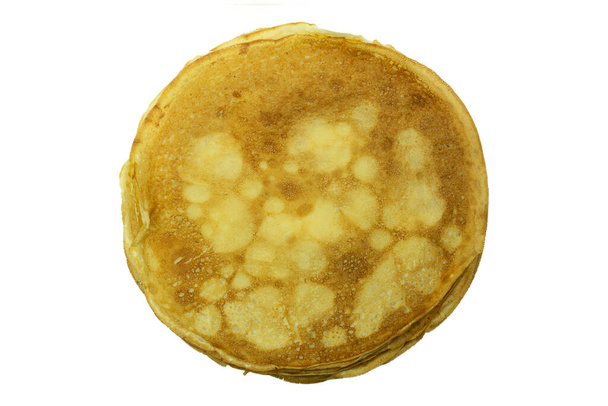 Pancakes su uno sfondo bianco isolato, vista dall'alto. frittelle piatte e rotonde a base di latte, farina e uova - Foto, immagini