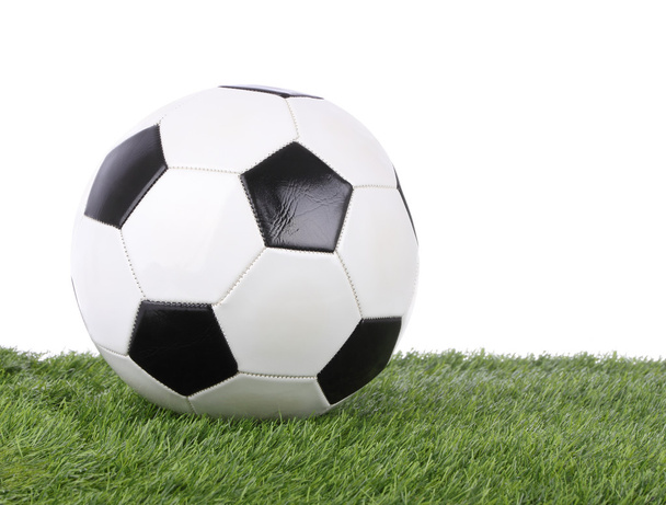 Stitch leather soccer ball on green grass field. - Fotoğraf, Görsel