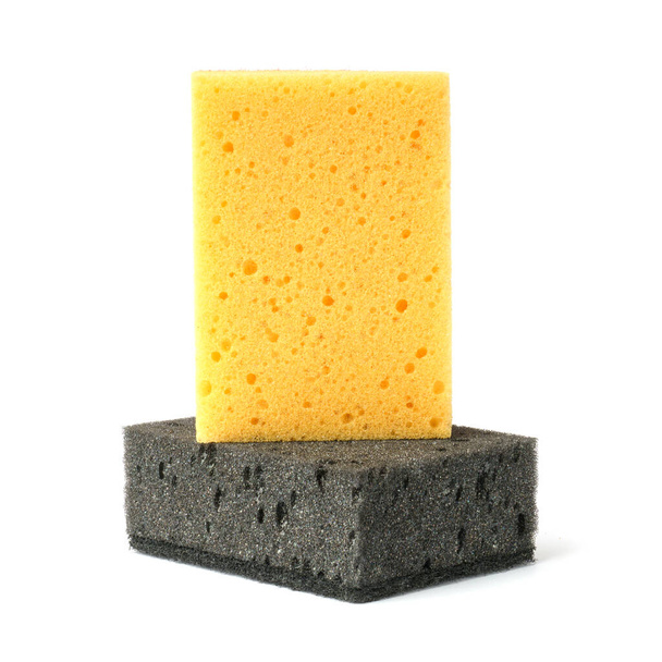 porous sponges for washing dishes isolated on white background. black and yellow kitchen sponges. close-up - Photo, Image