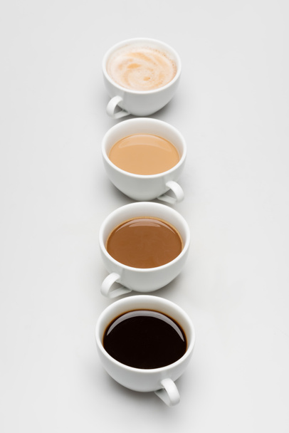 different freshy made coffee drinks with milk on white - Photo, Image