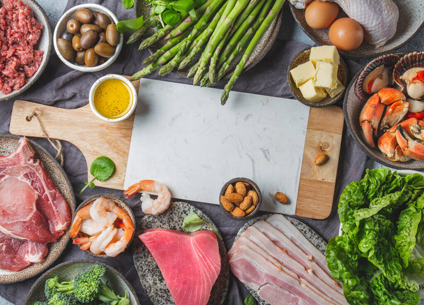 Food background with meat, eggs, fish, seafood, and vegetables. Top view, copy space - Foto, afbeelding