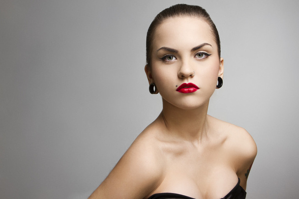 beautiful girl punk with tattu, piercing, red lipstick and perfect skin - Photo, Image