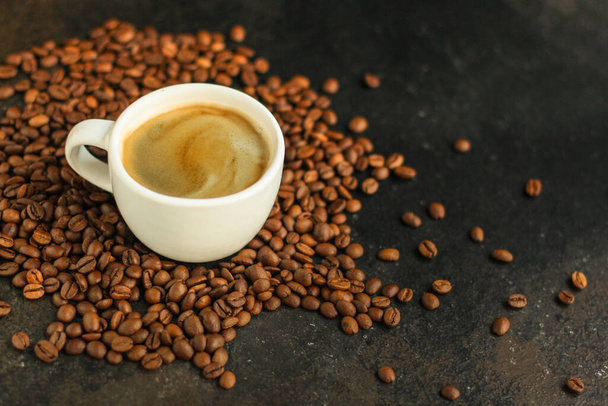 coffee cup with roasted beans on a dark background  - Φωτογραφία, εικόνα