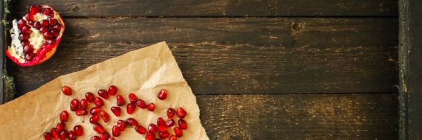 fresh pomegranate seeds on wooden background - Photo, Image