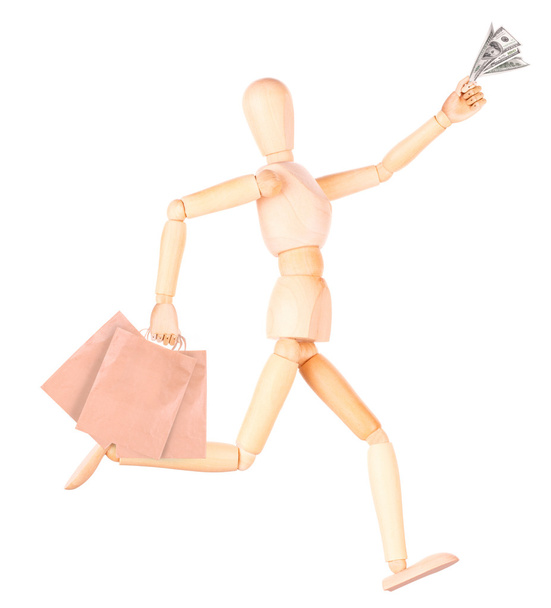 Wooden Dummy with shopping bags and money - Photo, Image