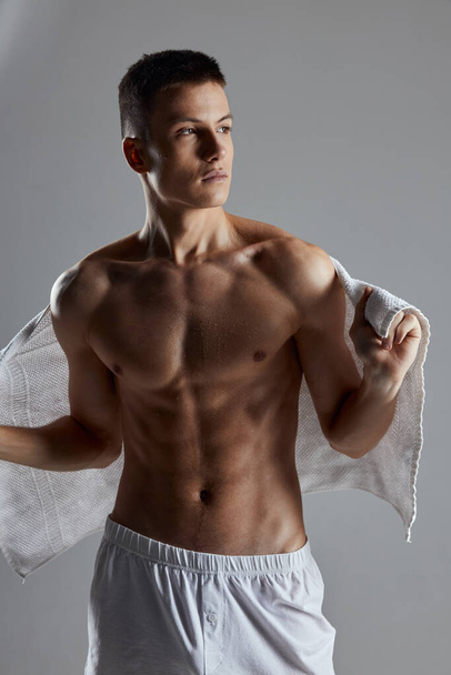 sporty man with muscular torso white workout towel - Photo, Image