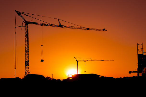 Construction crane silhouette sunset scaffolding architecture eigenheim engineering bausparen - Photo, Image