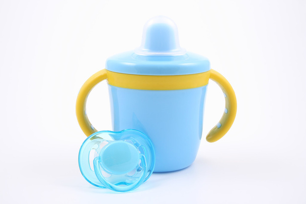 taza de bebé azul y chupete
 - Foto, Imagen