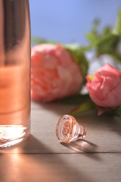 Closeup Bottle Of Pink Rose Wine and Spring Flowers - Photo, Image