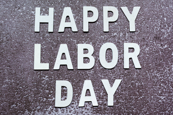 Happy labor day text on grunge grey concrete background - Photo, Image