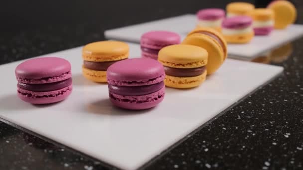 Colorful macaroons on plate with clipping path. - Footage, Video