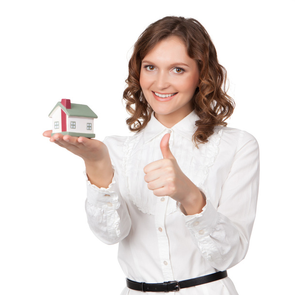 Beautiful young woman holding house model - Photo, Image