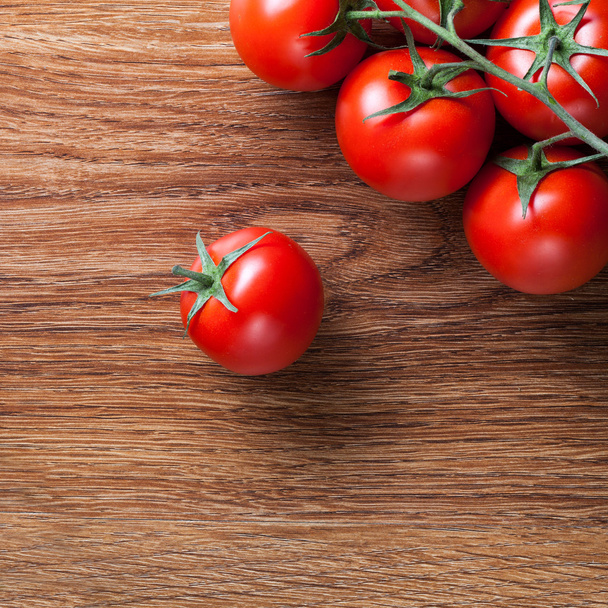 red tomatoes with green salad on wood - Fotoğraf, Görsel