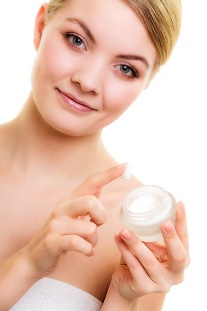 Girl applying moisturizing cream - Zdjęcie, obraz