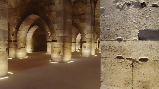 Interior of historical building with stone arches and domes.Cathedral minster church sultan Han caravanserai caravansary khan wikala funduq medieval architecture caravanserais temple chapel column columns arch niche courtyard detail ornamental mosque - Footage, Video