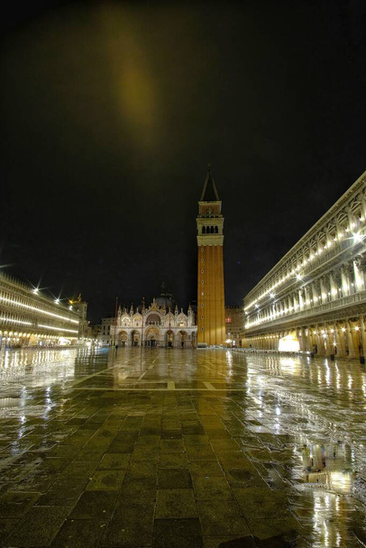 Bell tower and historical buildings at night at Piazza San Marco in Venice, Italy. - Photo, Image