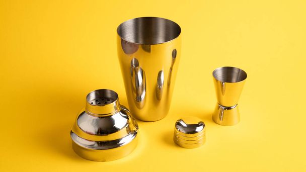 Cobbler shaker and jigger. Vertical image. Bar accessories. Cocktail utensils. Set of bar tools - Photo, Image