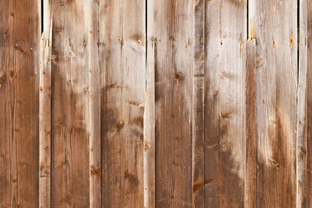 Weathered wood background with brown colored planks with fading colors - Fotó, kép