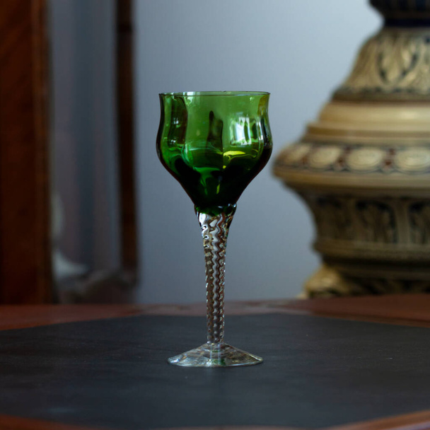 green vintage wine glass close-up. antique wine glass - Photo, Image