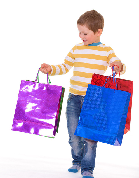 Little boy with packages. - Foto, Imagen