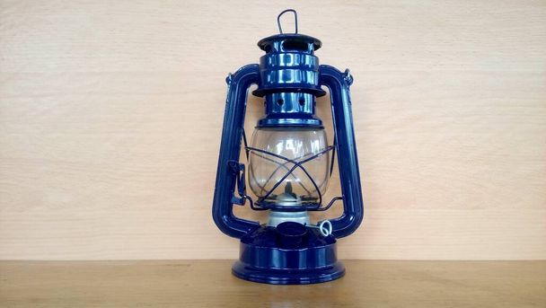 kerosene lantern on the wooden background - Photo, Image