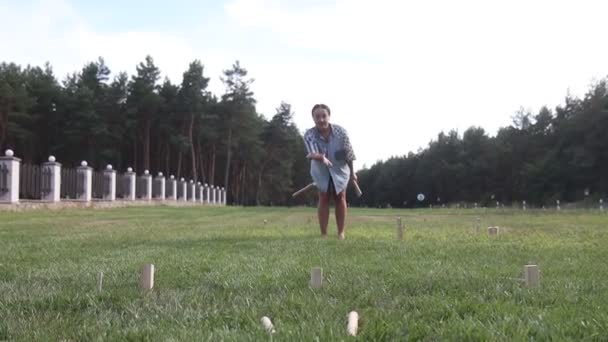 girl throws a stick in the viking chess game - Footage, Video
