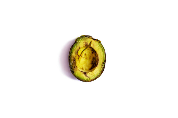 over-ripe, spoiled avocado on a white background. - Foto, imagen
